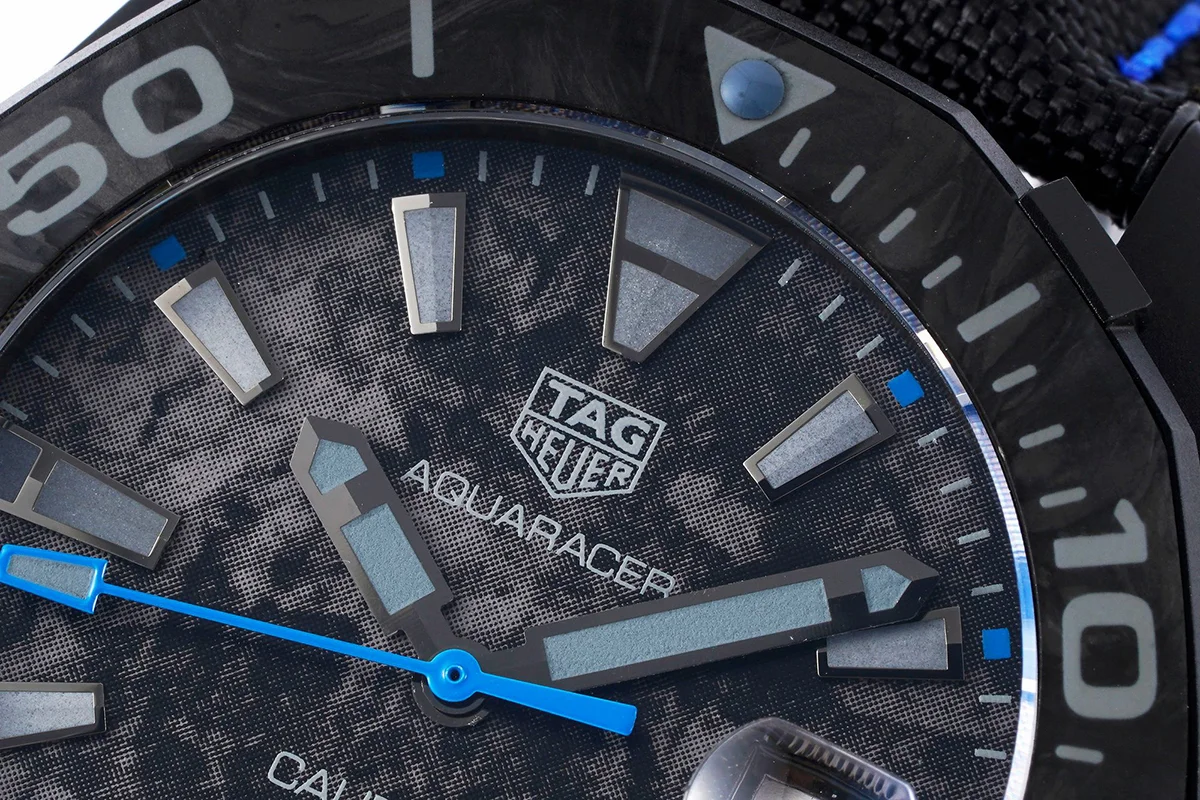 Aquaracer Calibre 5 Carbon Dial with Blue Tachymeter